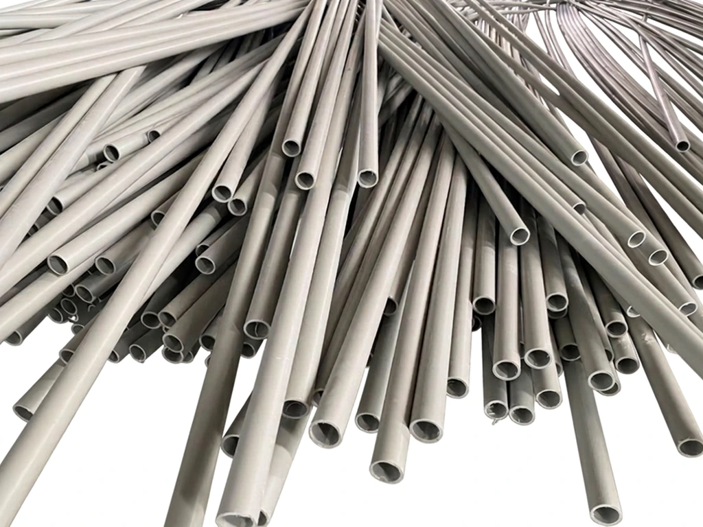 SNGT 25 mm PVC pipes stacked at the factory